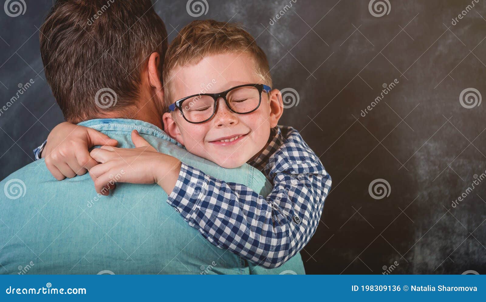 son hugging his dad. caring dad foster parent give support his child boy. single father holding son in hands and