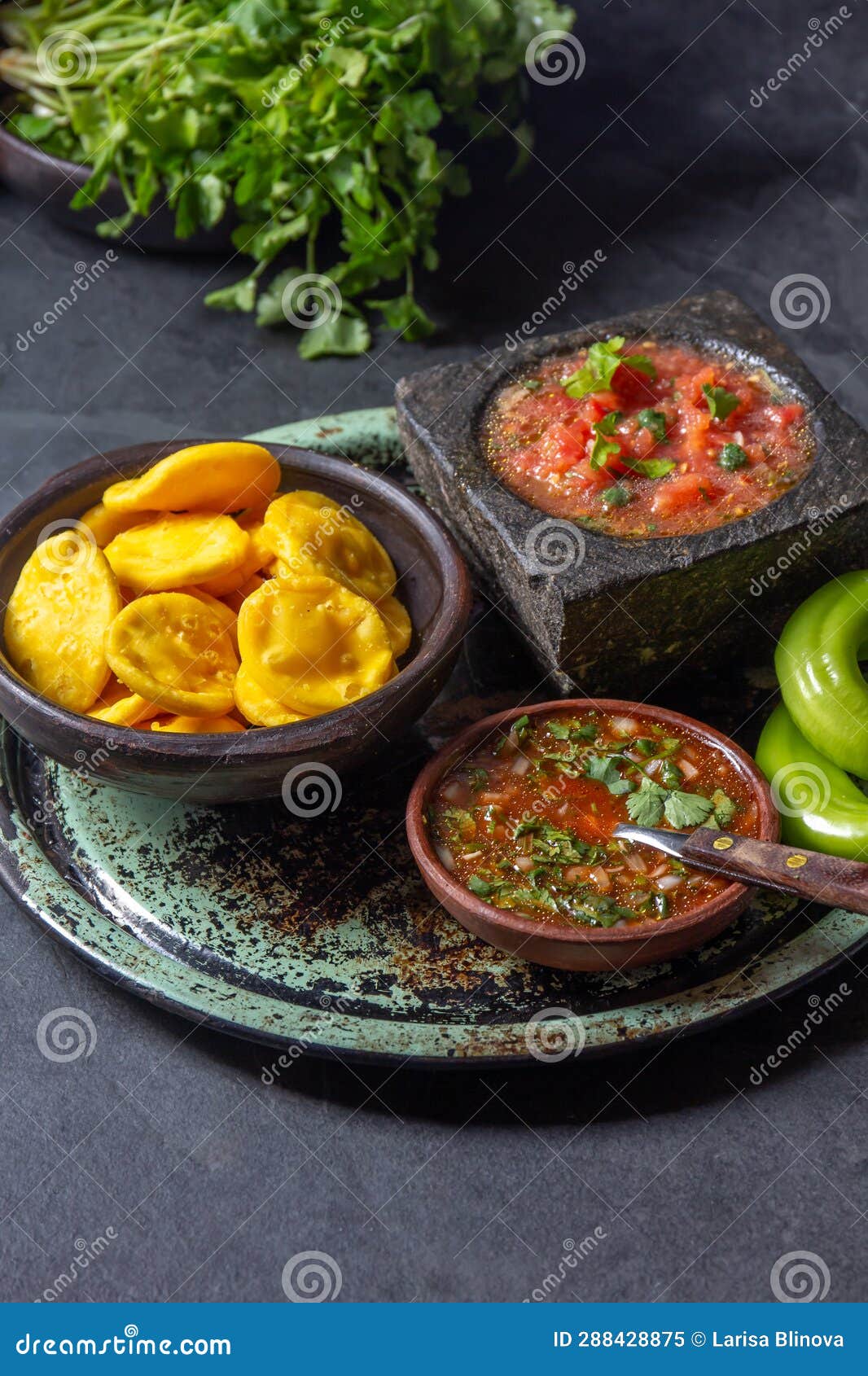 sopaipilla. latin american food. traditional chilean homemade pumpkin sopaipillas with typical salsas - chancho en