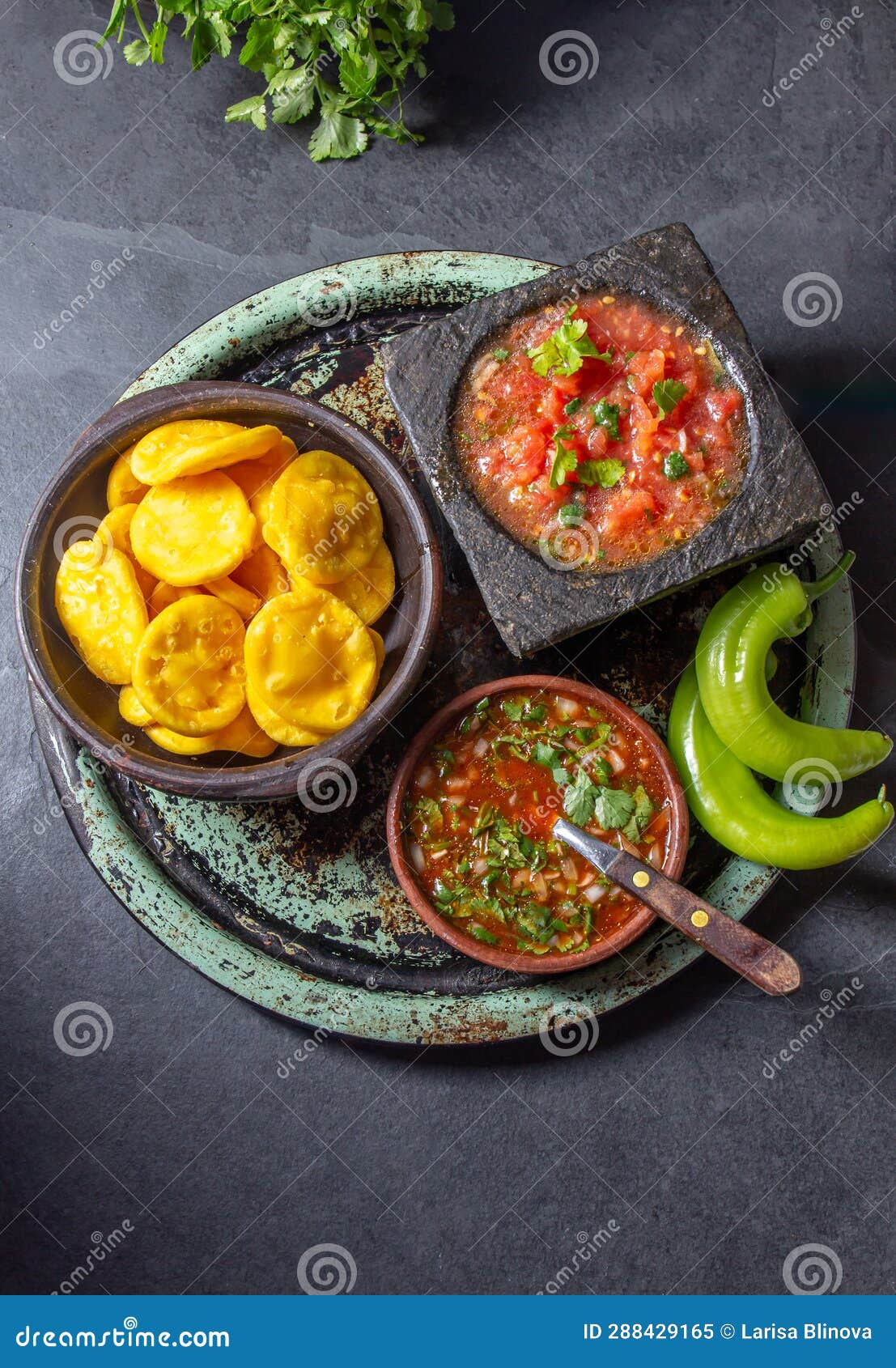 sopaipilla. latin american food. traditional chilean homemade pumpkin sopaipillas with typical salsas - chancho en