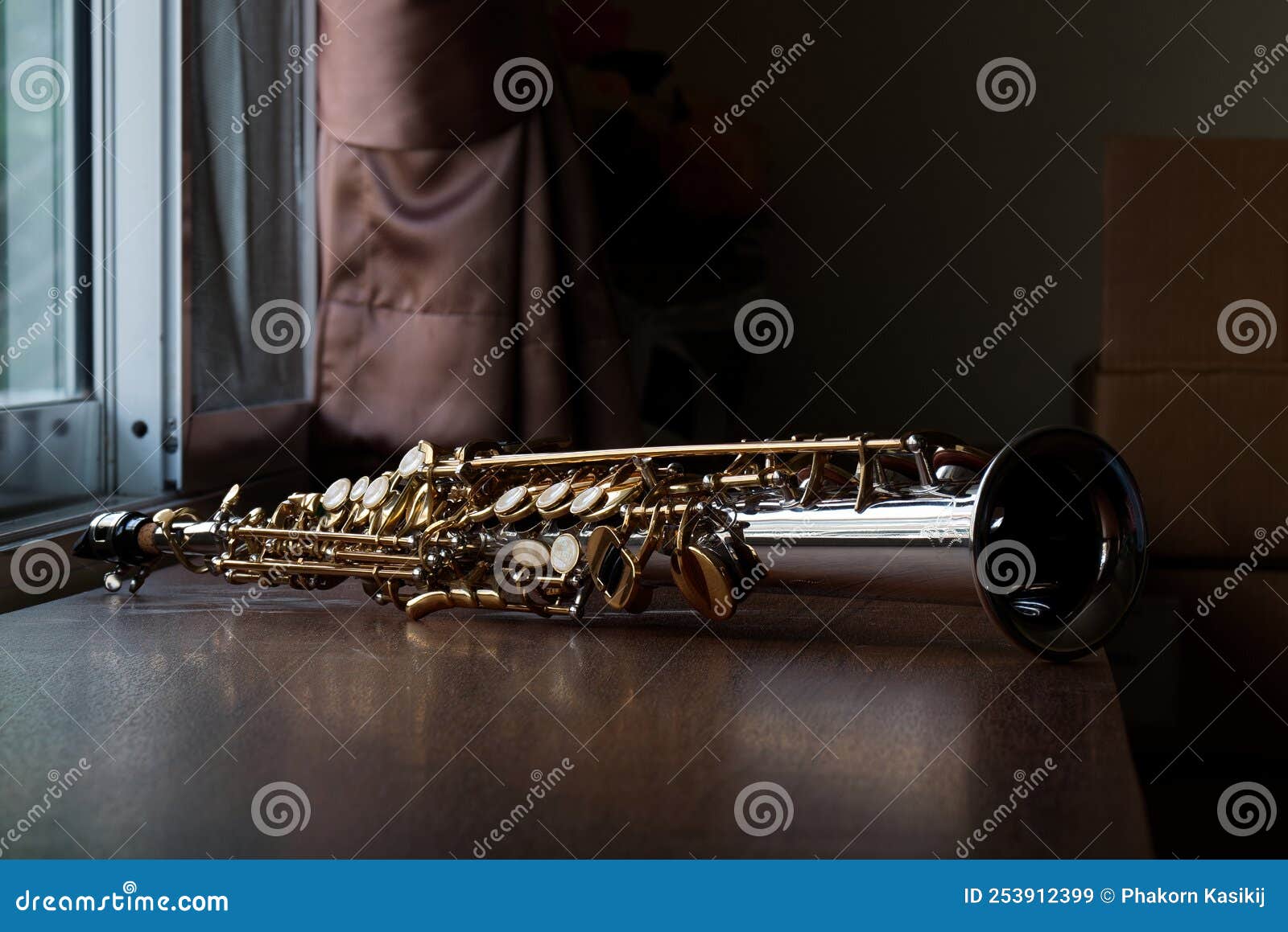 soprano saxophone mouthpiece, closeup woodwind instrumental equipment on blur saxophone background