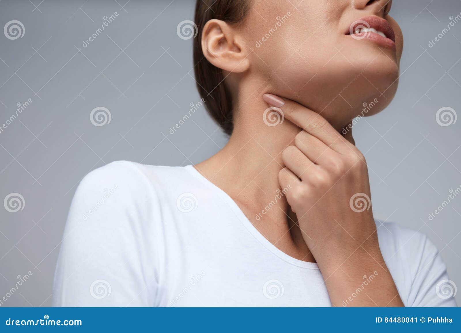 sore throat. closeup beautiful woman hands and neck. throat pain