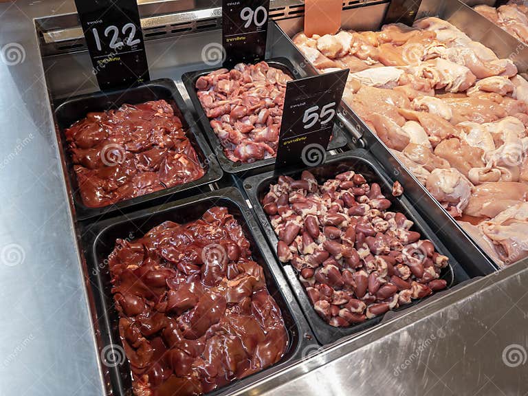 Sorted chicken internal organs for sale at the butcher s in a