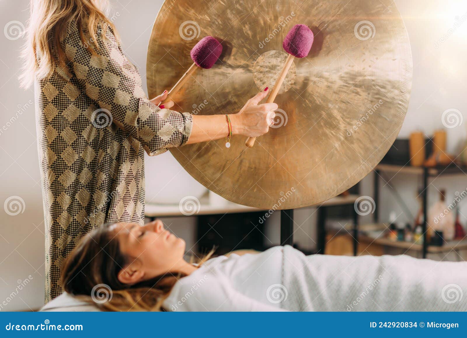 Sound Bath Therapy, Playing Gong Stock Photo Image of bath, vibration
