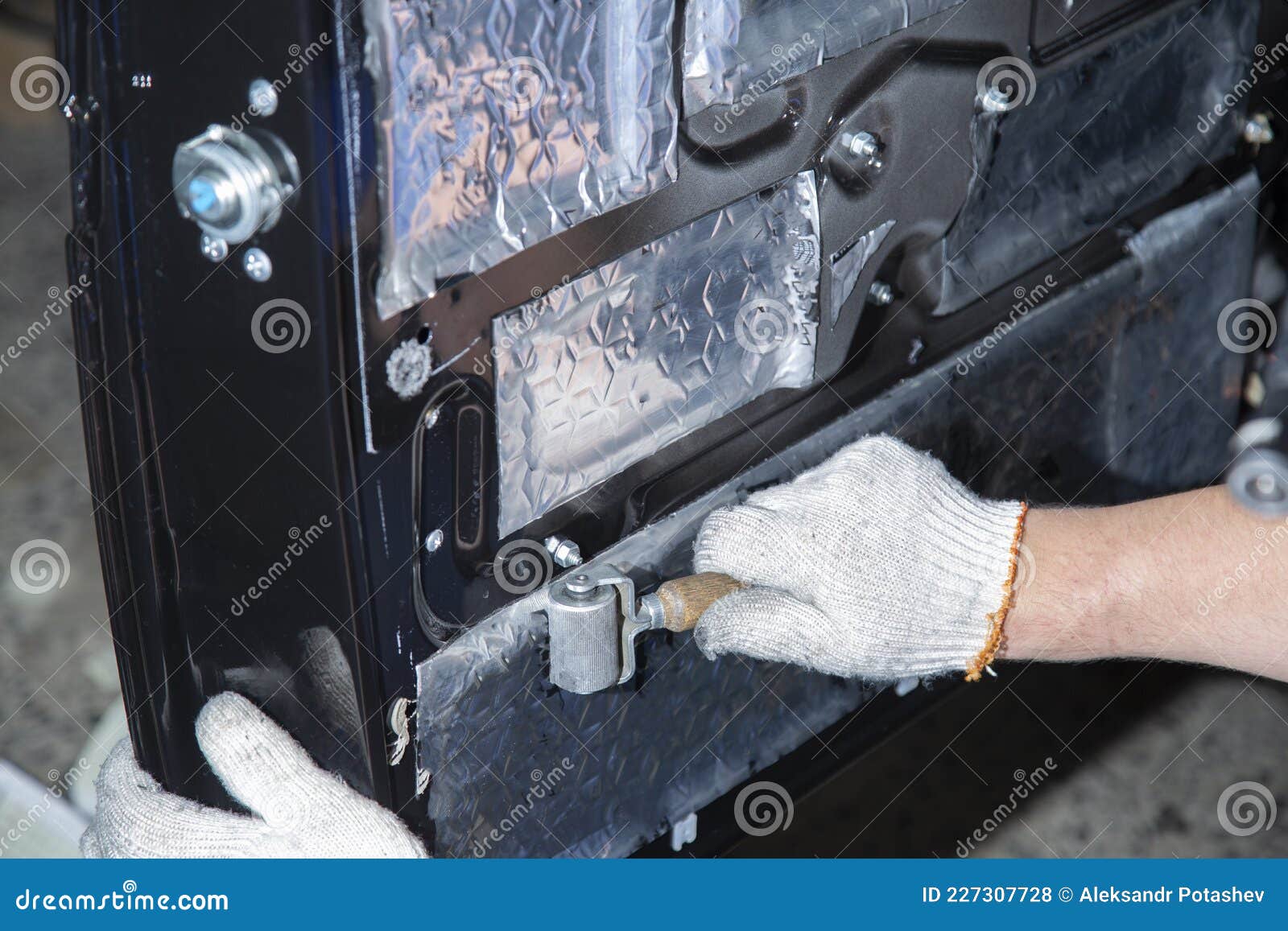 Sound Insulation of the Car. Installation of Sound Insulation Material on the Car Stock Photo