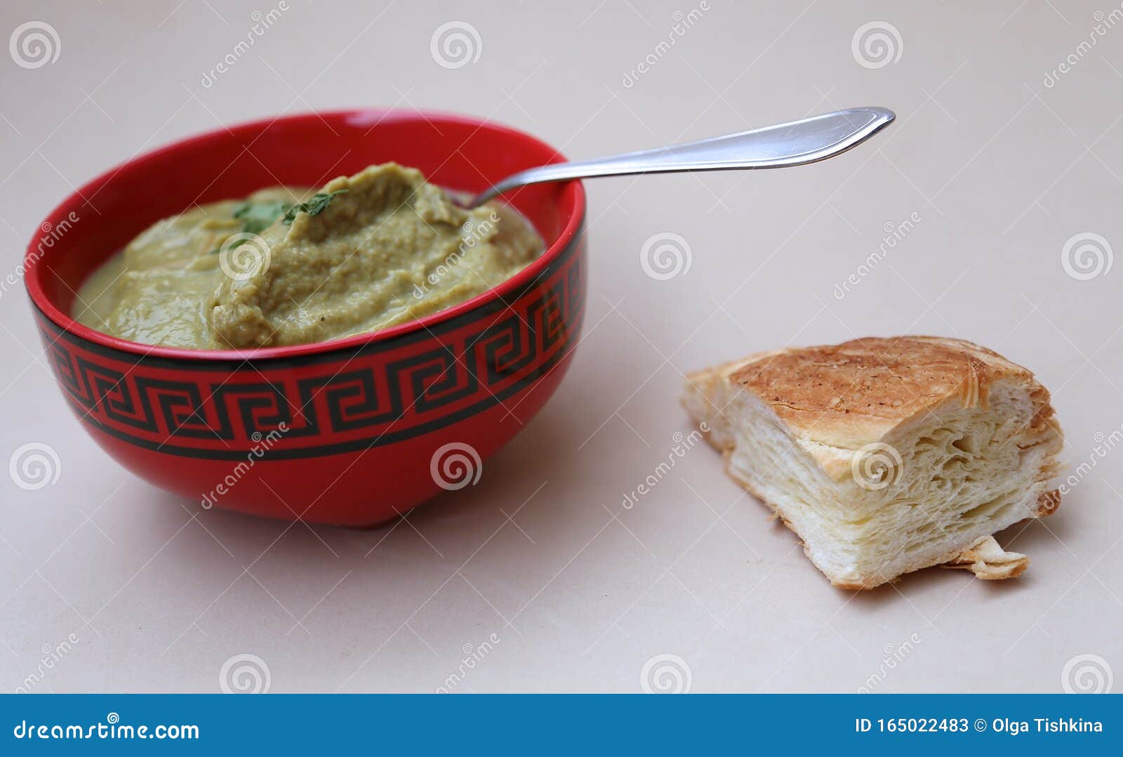 Soup Strained with Broccoli on a Table, a Spoon and a Piece of Fresh