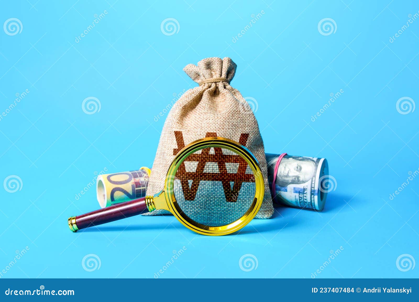 south korean won money bag and magnifying glass. investigating capital origins. anti money laundering, tax evasion. find