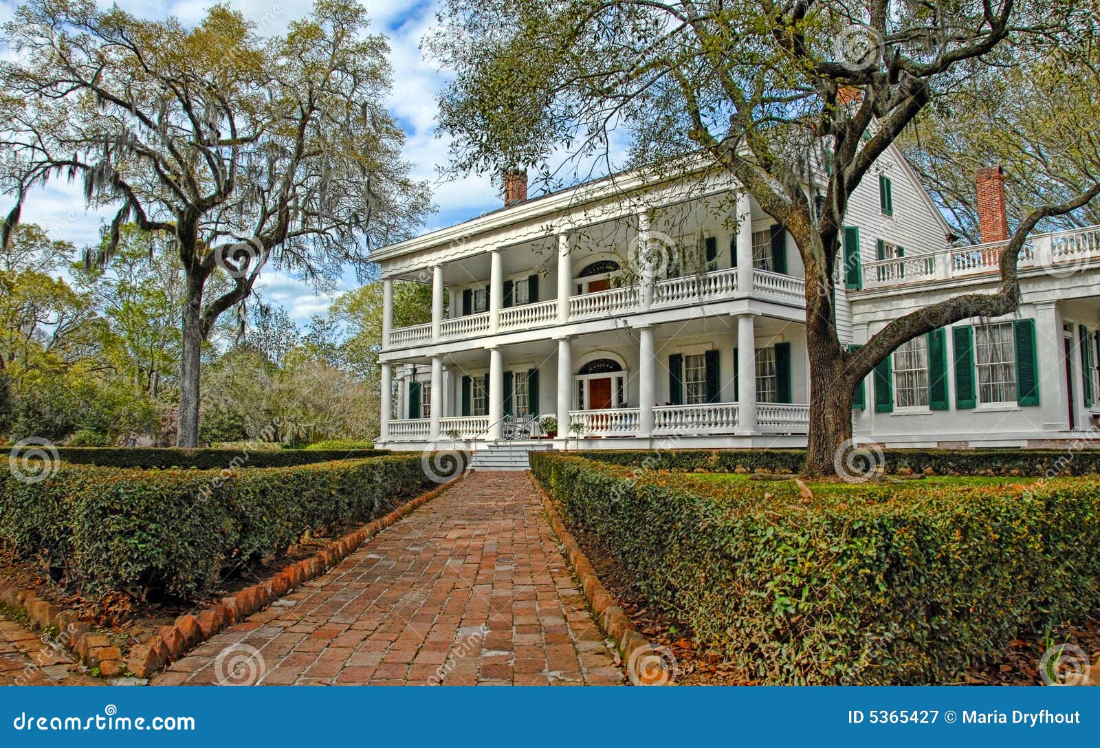 southern mansion with brick walkway