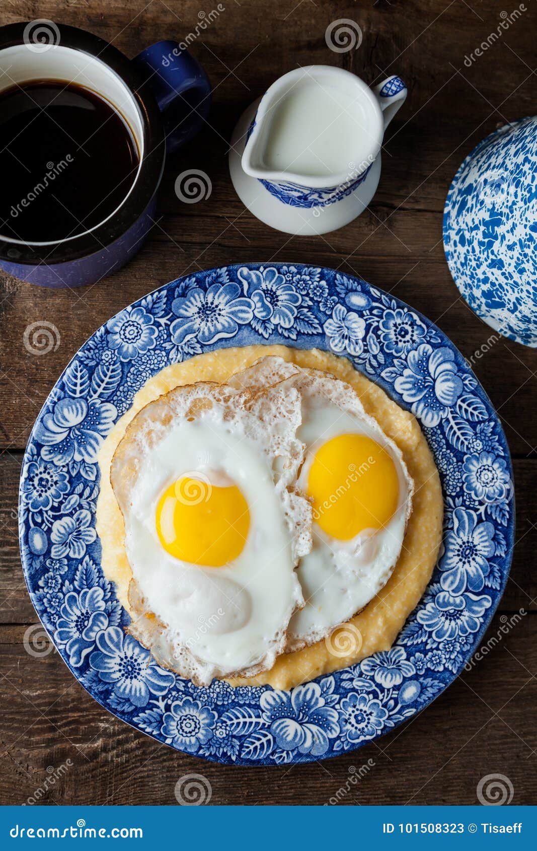 Southern Style Grits Served with Two Sunny Side Fried Eggs Stock Image