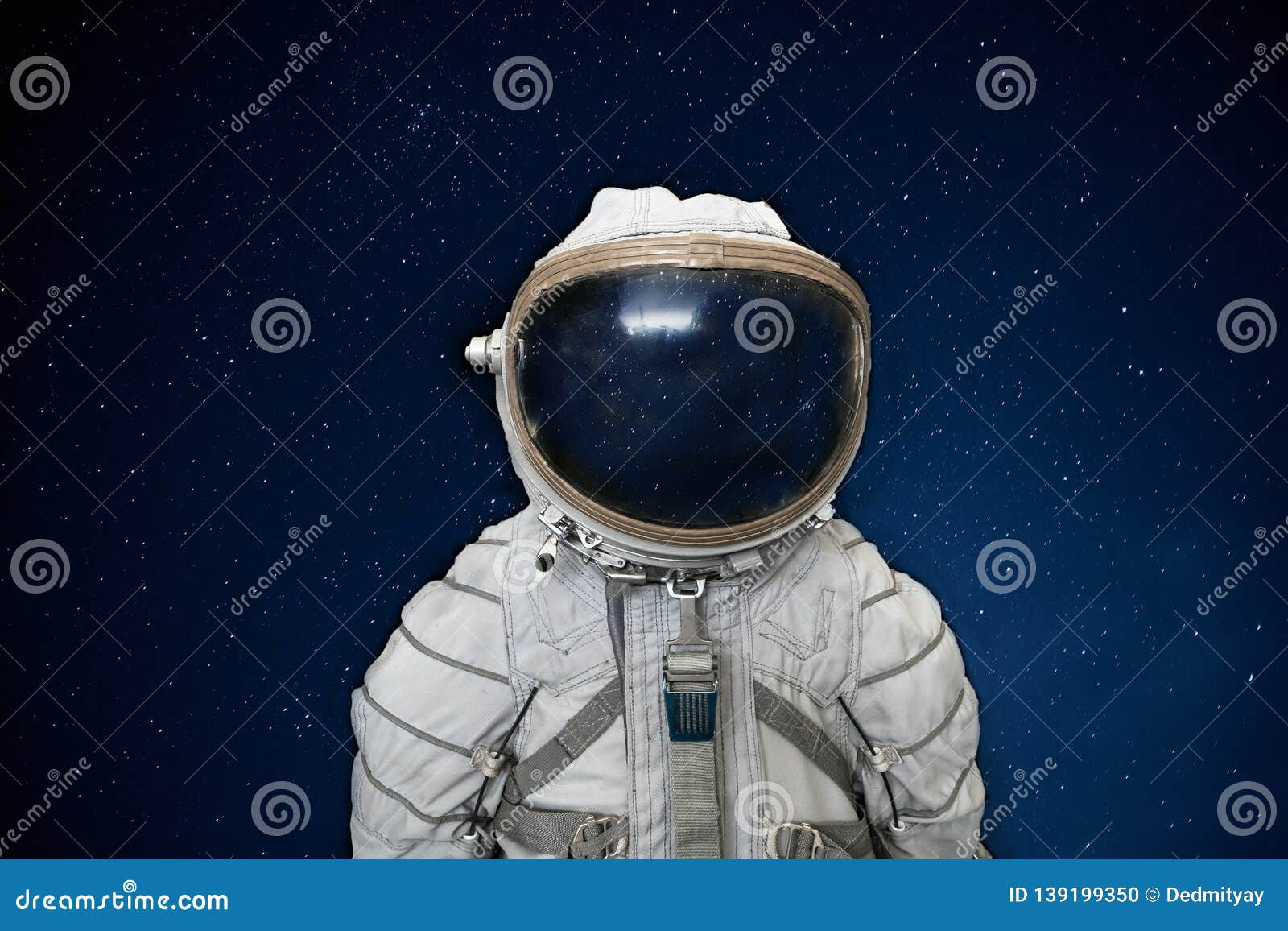soviet cosmonaut or astronaut or spaceman suit and helmet on black space with stars background