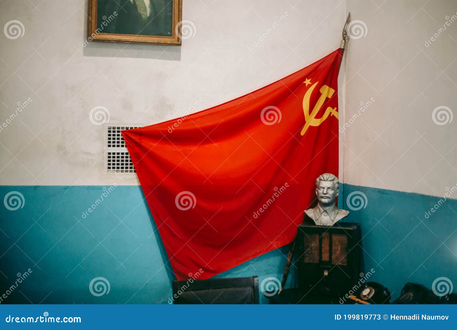Soviet Red Flag with a Sickle and a Hammer and a Bust of Lenin in the