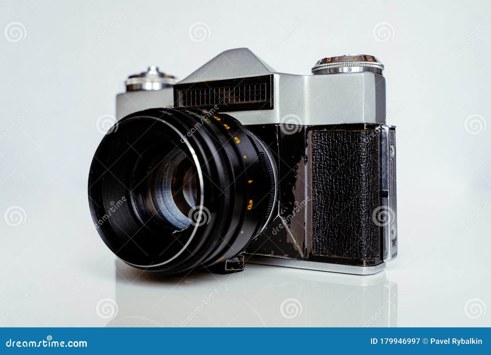 a soviet union camera zenit e produced in 60s and 80s as an analogue to the german leica. very old film camera in shabby 