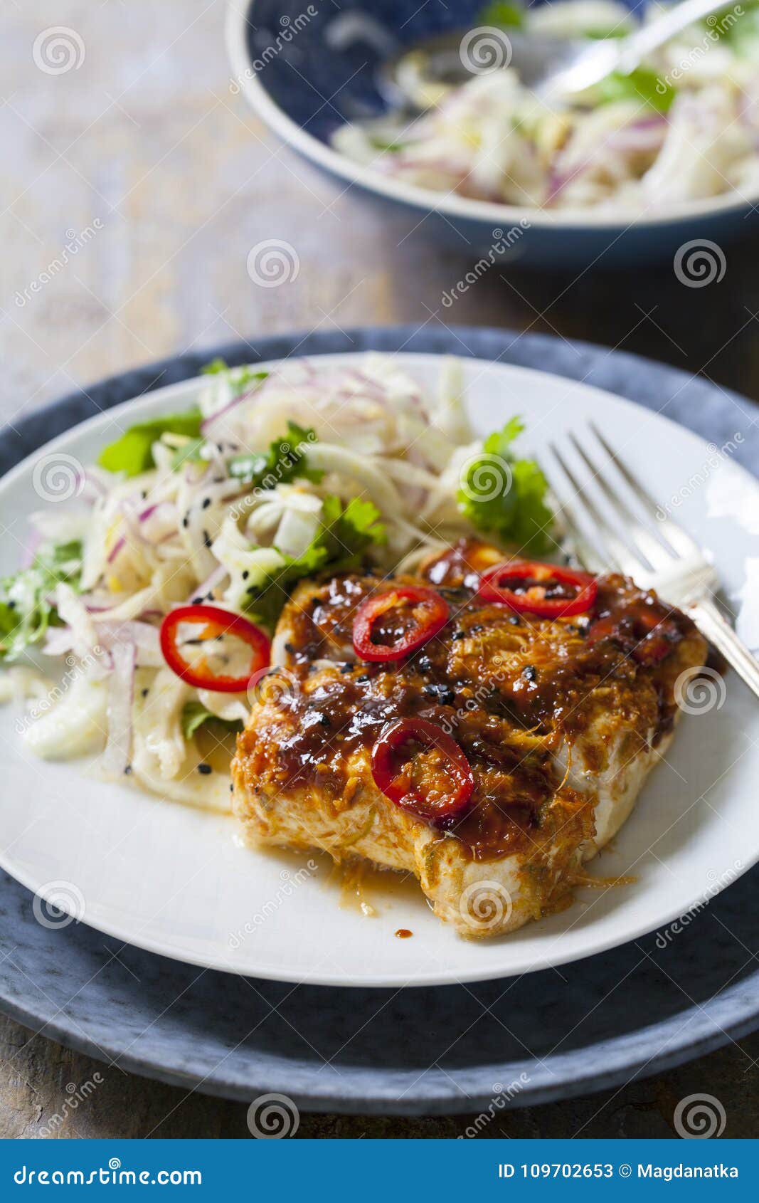 Soy and Ginger Glazed Cod with Fennel and Onion Salad Stock Image