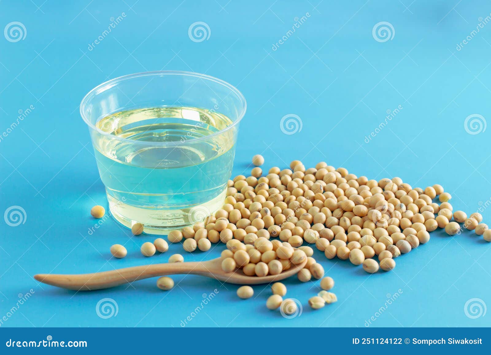 Soybean and Oil in a Bowl on Blue Background, Selective Focus.copy