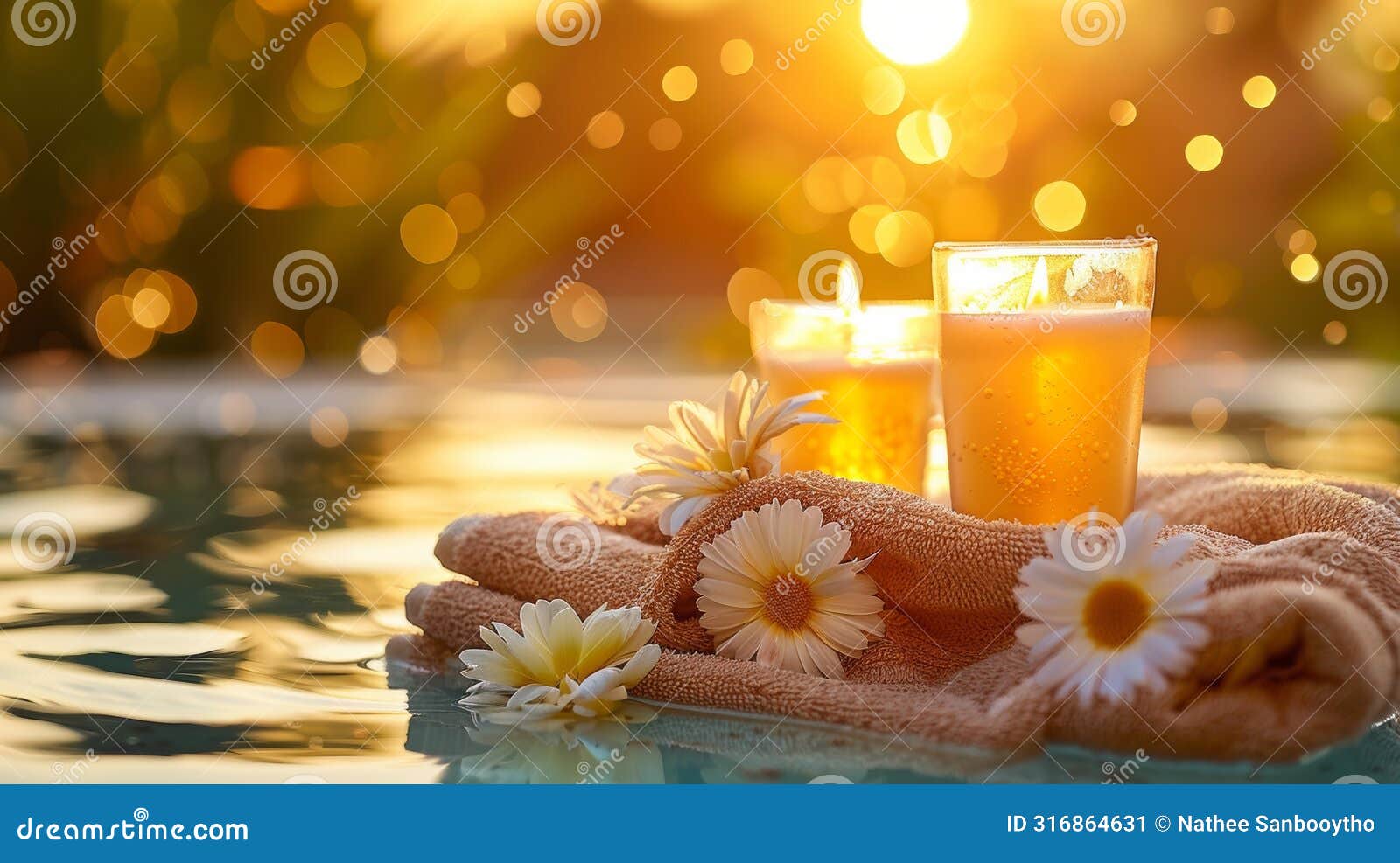 spa ambiance with candles and flowers at sunset