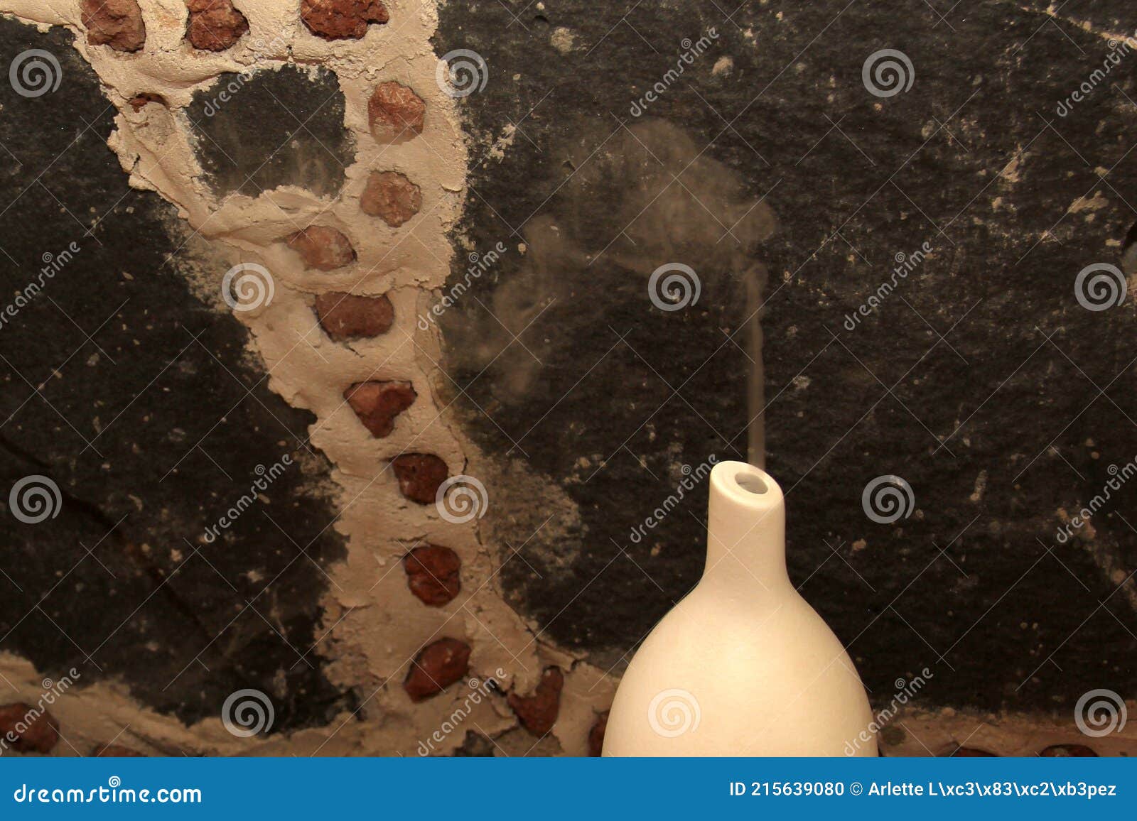 spa decoration, scented candles and aromatherapy diffuser on rustic stone and wood background