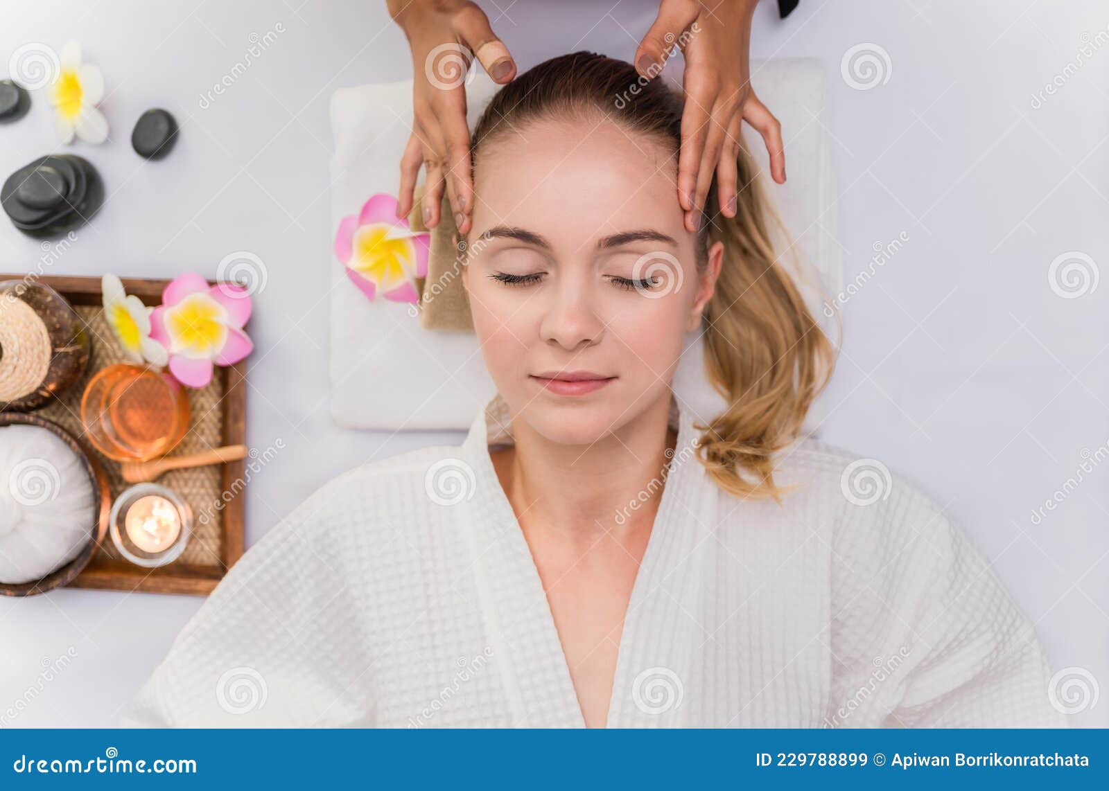 Beautiful Young Woman Sleeping And Relaxing With Face Massage And Treatment In Spa Salon Stock