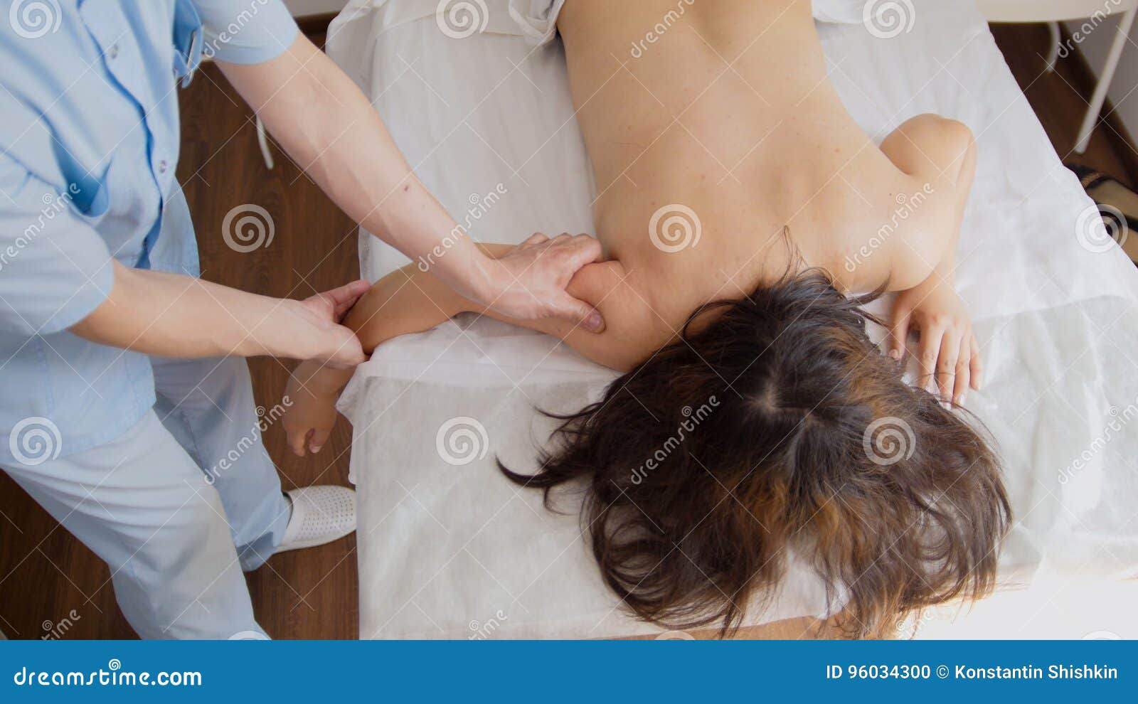 Spa The Hands Of The Massage Therapist Make A Massage On The Arm Stock