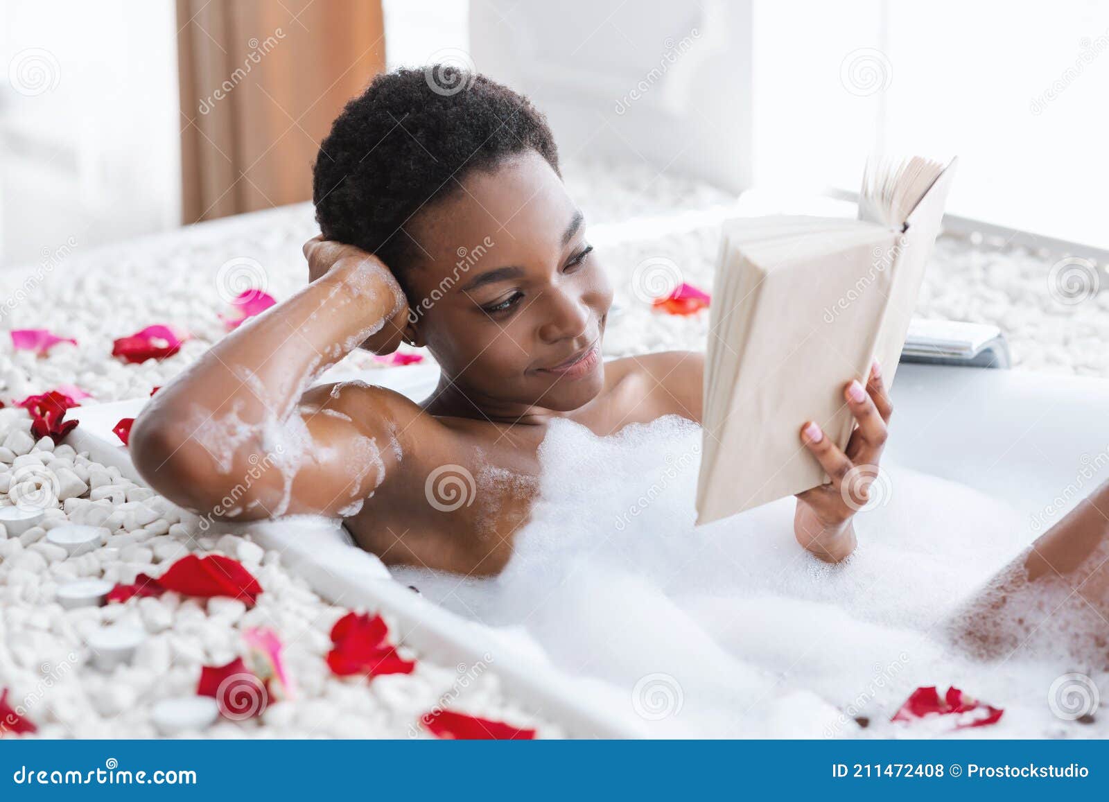 Woman Taking A Bubble Bath At Her Home