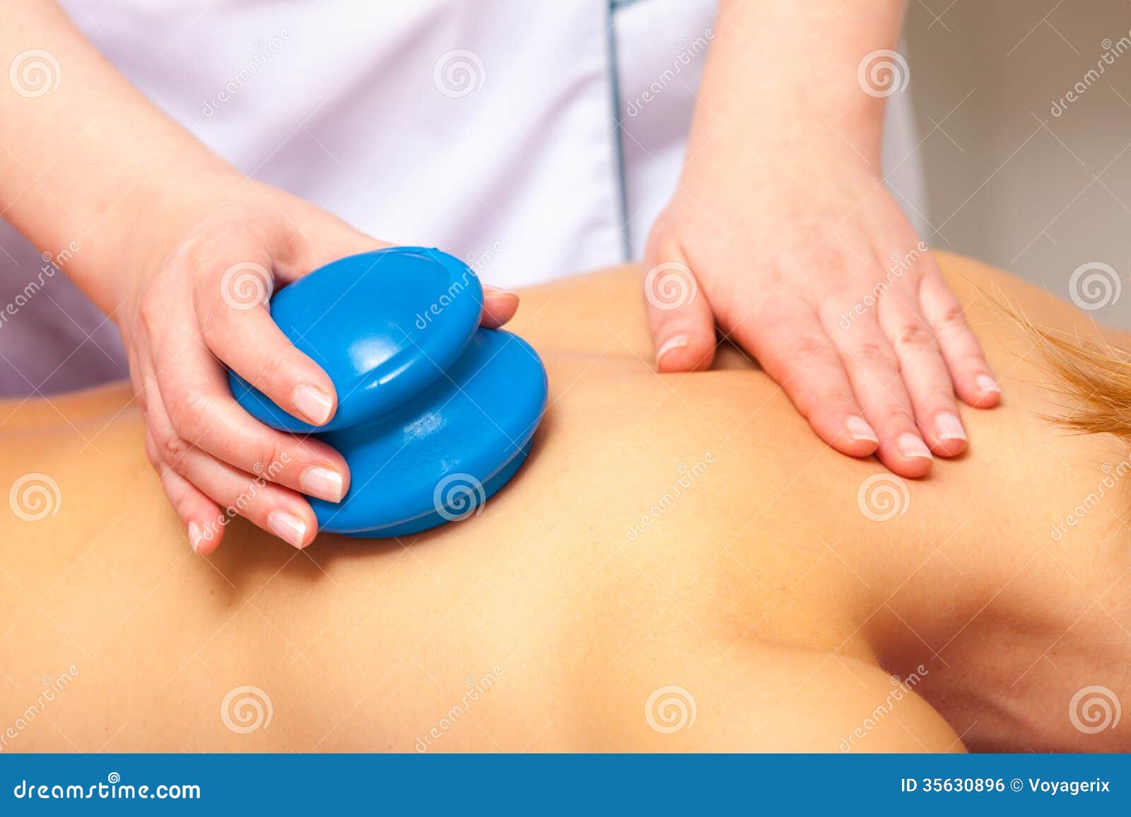 spa salon. woman relaxing having cupping-glass massage. bodycare.