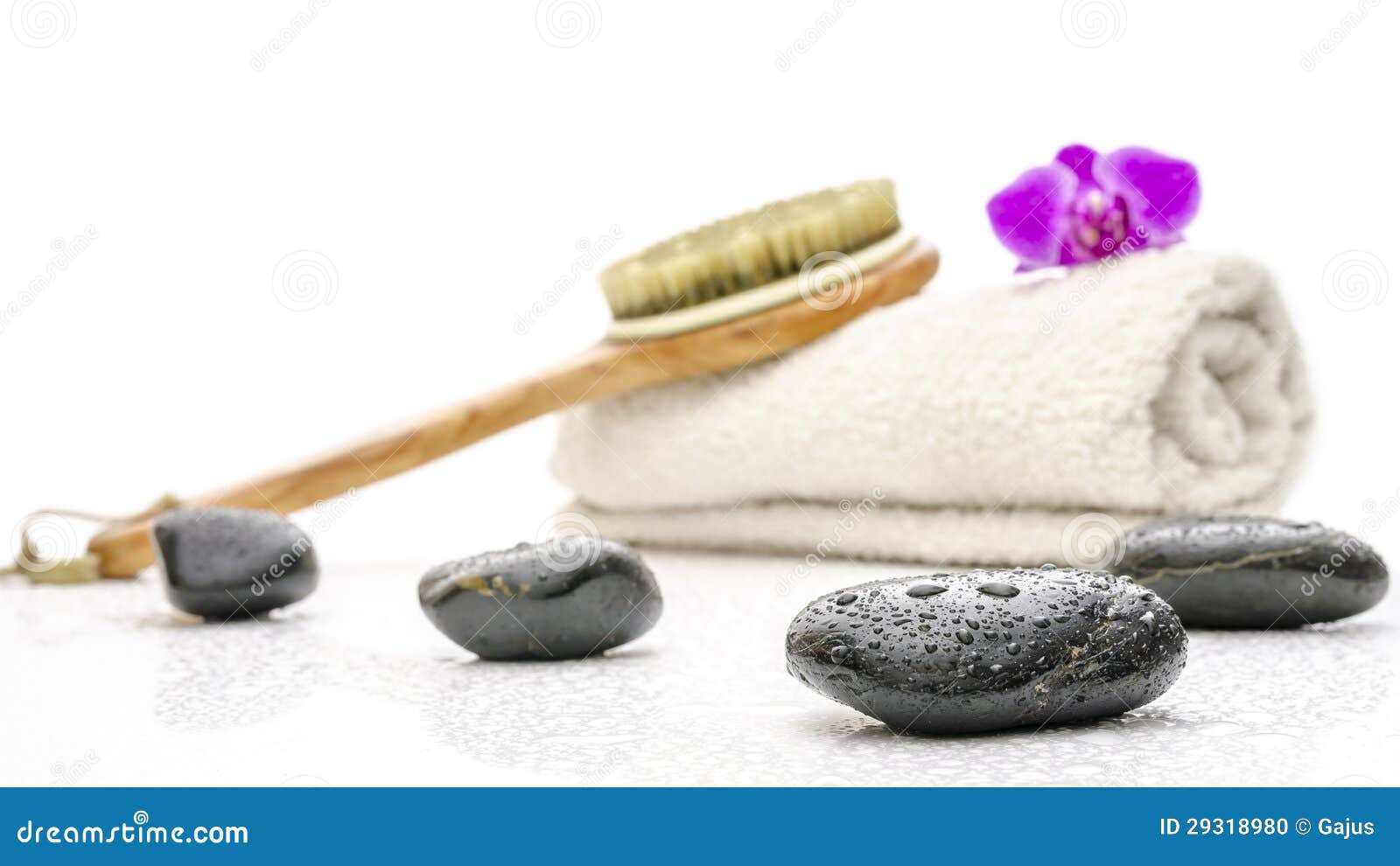 Spa Setting with Massage Stones, Brush and a Towel Stock Photo Image