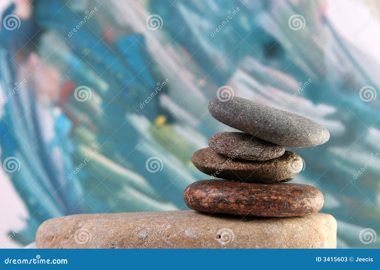 Balanced spa stones at painted background