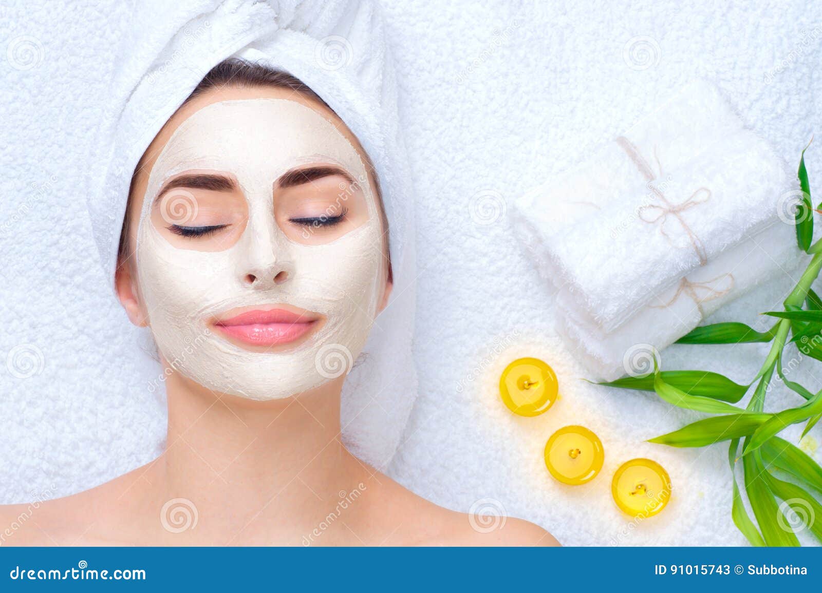 spa woman applying facial mask