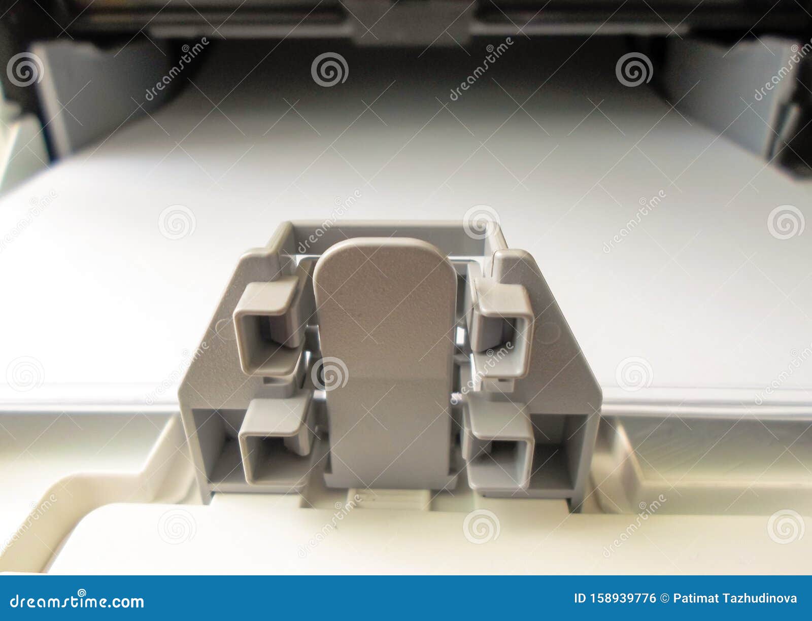 Paper Tray on the Printer. Closeup Printer with White Paper Stock