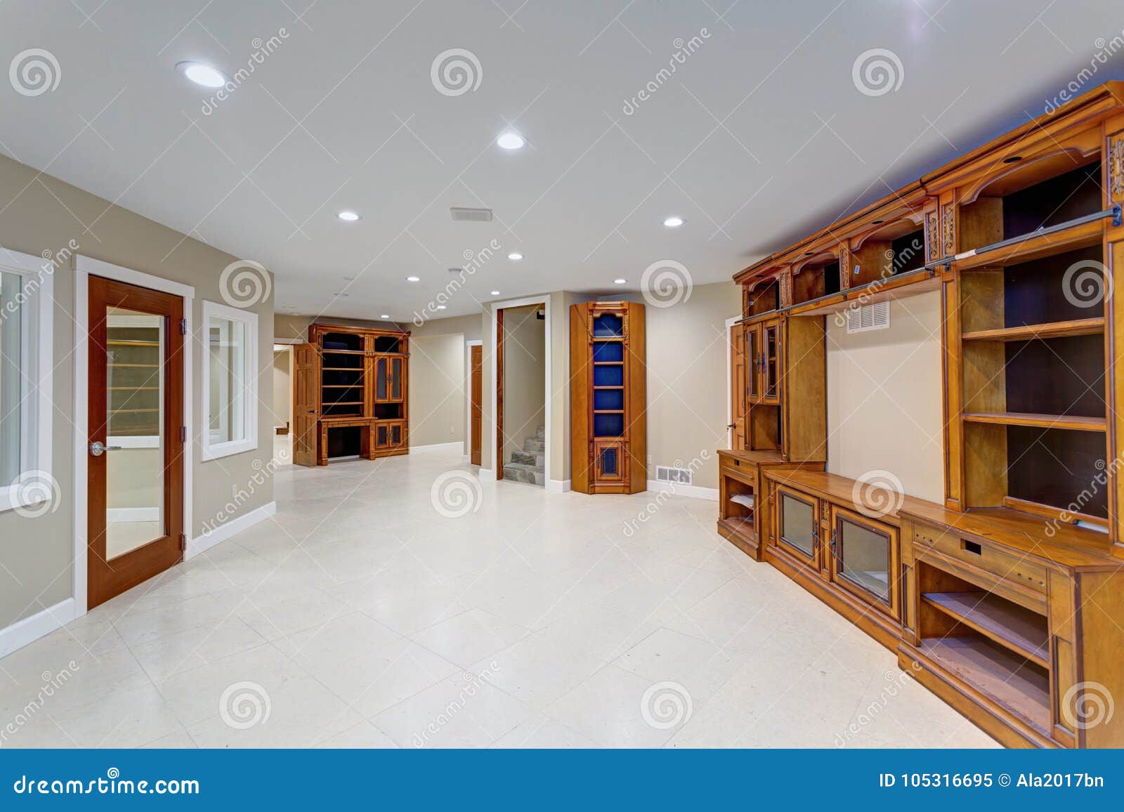 Spacious Basement Area With Large Custom Built Bookcase Stock