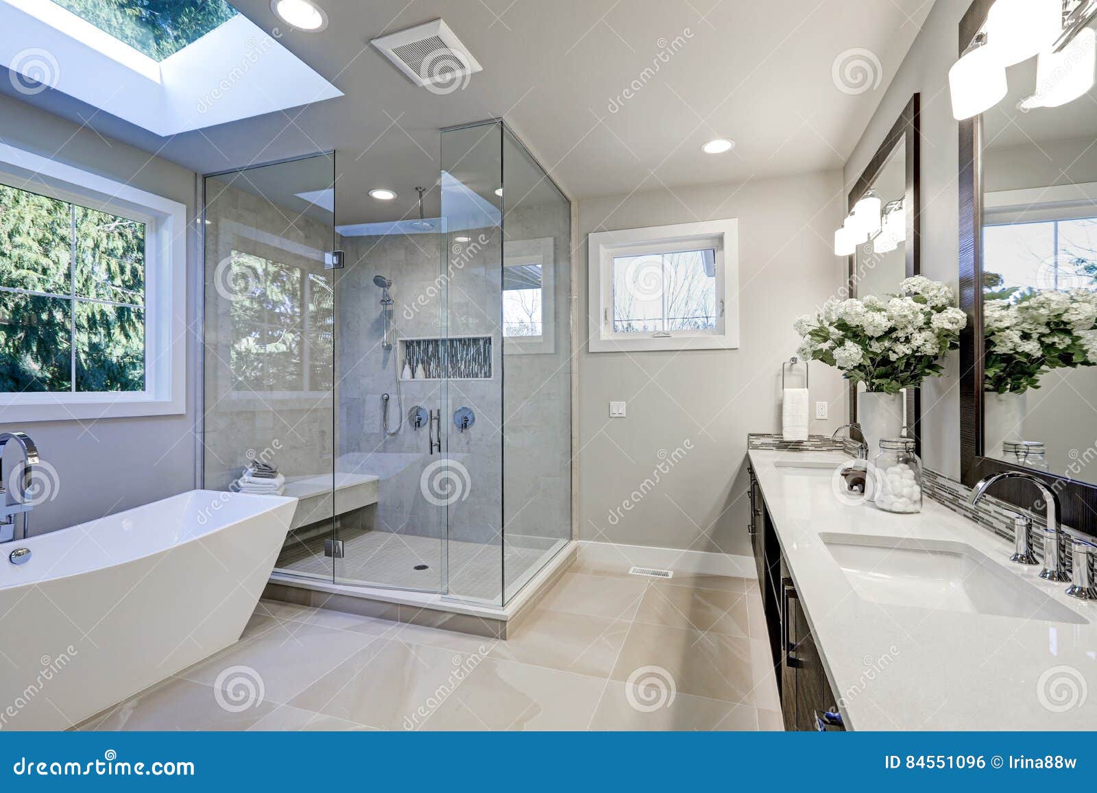 spacious bathroom in gray tones with heated floors