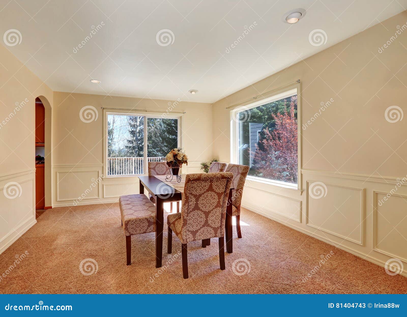 Spacious Dining Room Interior with Upholstered Bench Stock Image