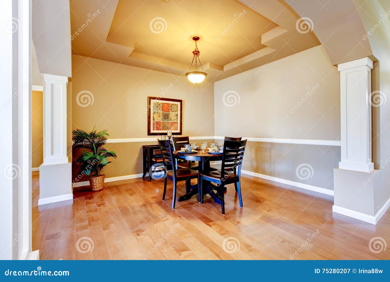 Spacious Dining Room With White Columns And Beige Tray