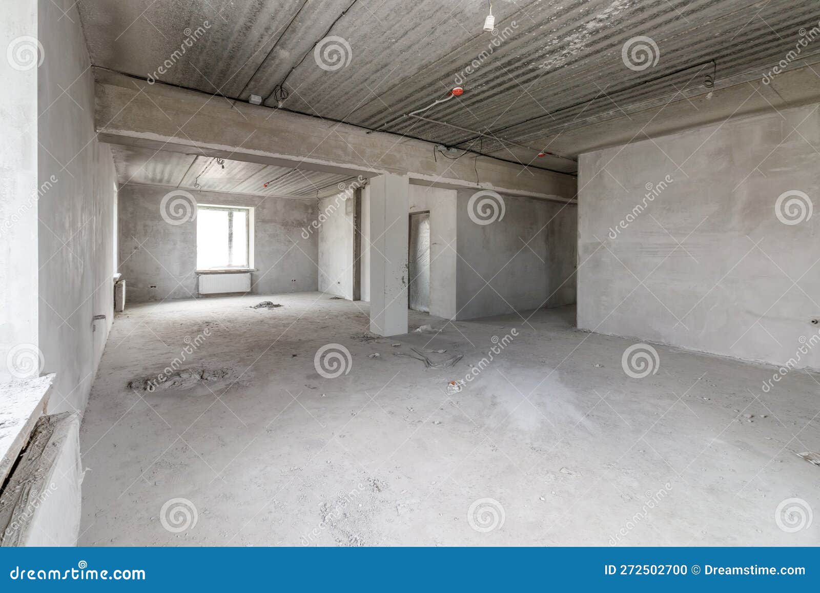 spacious empty rooms in the attic floor after filling out the work on the wall and ceiling