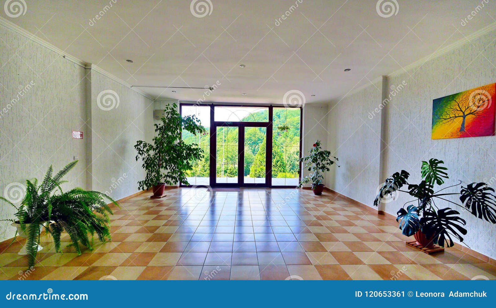 A Spacious Hall With A Balcony Multi Colored Tiles On The Floor