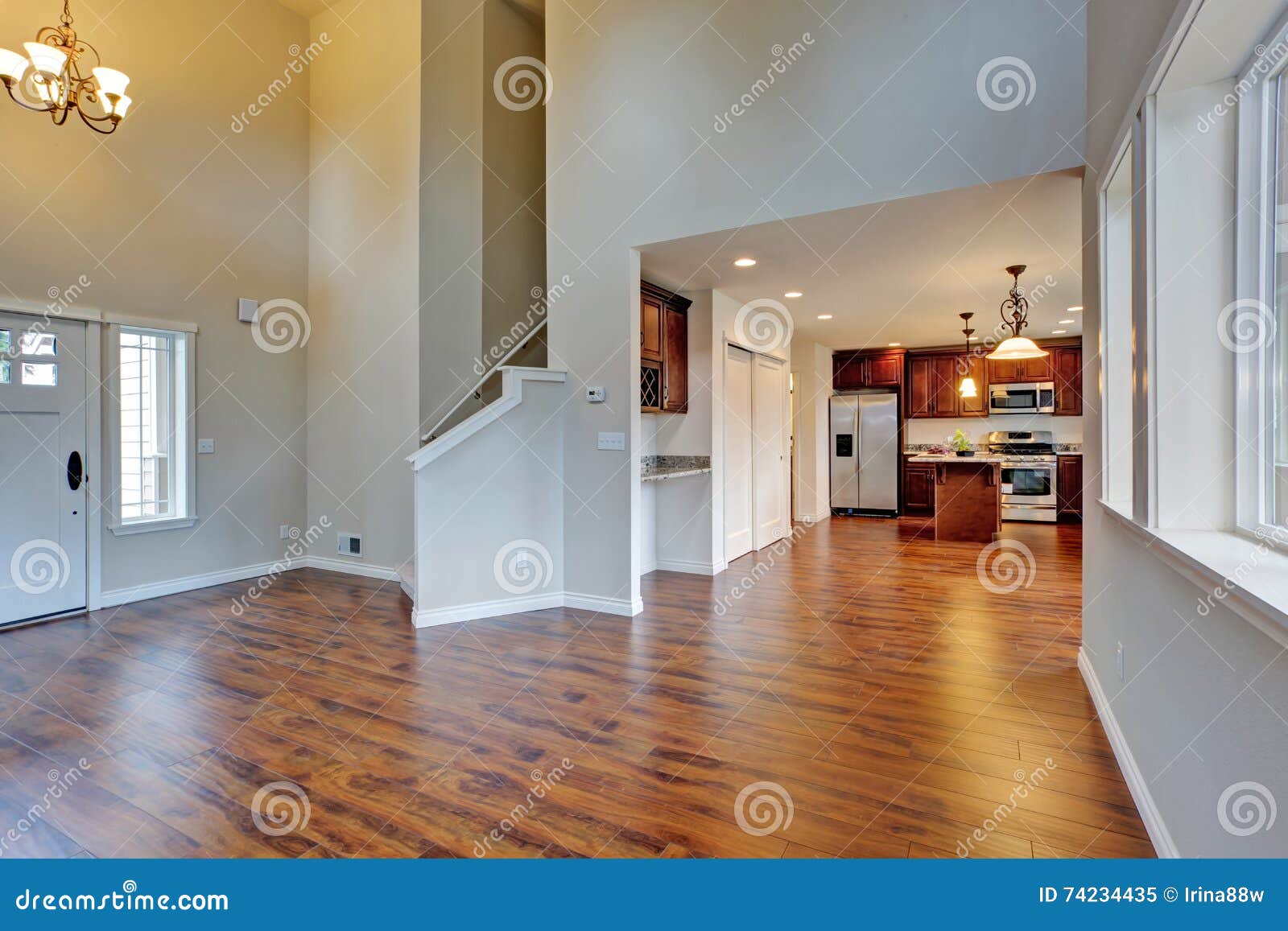 Spacious Living Room With High Vaulted Ceiling Connected To