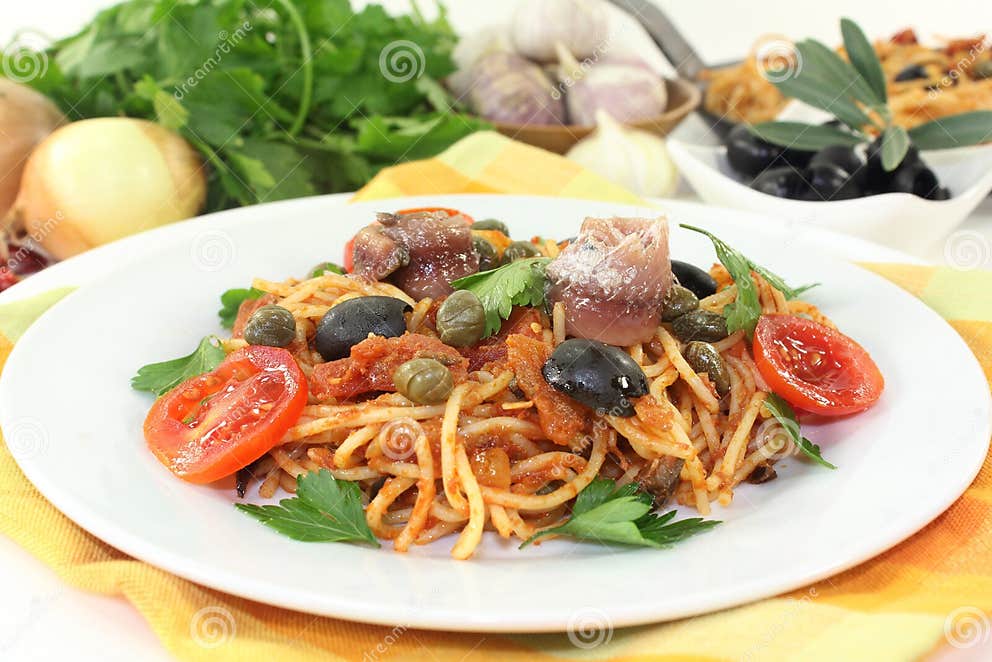 Spaghetti alla Puttanesca stock image. Image of spaghettini - 45688041