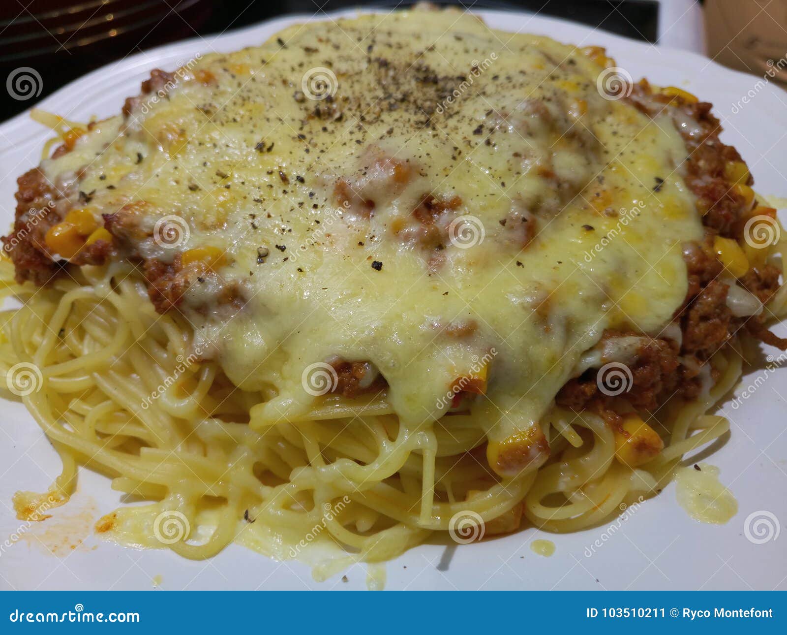 Spaghetti Bolognese with a Thick Layer of Cheddar Cheese Stock Image