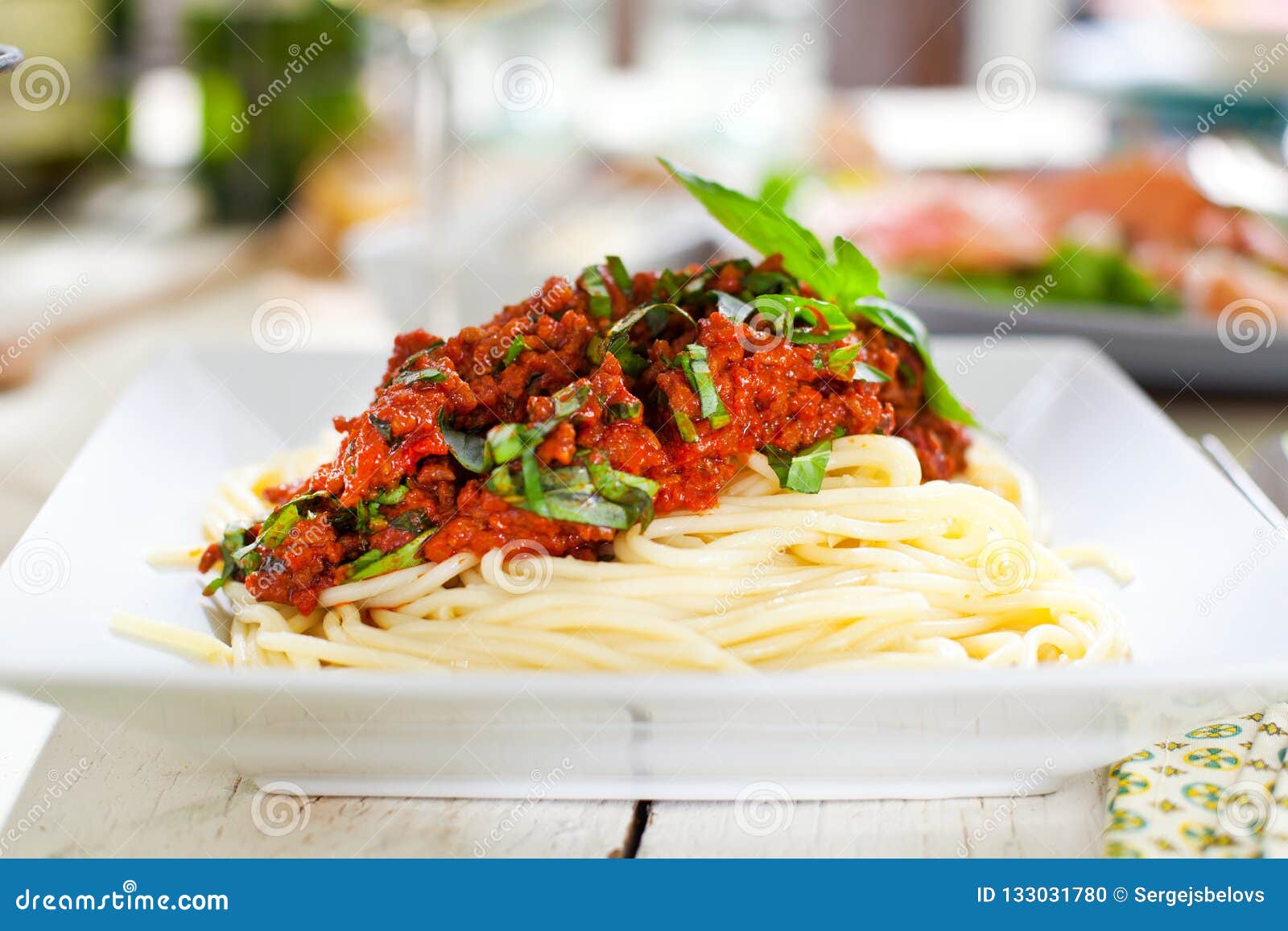 Spaghetti Dinner with Meat Sauce and Basil Close Up Bolognese. Stock