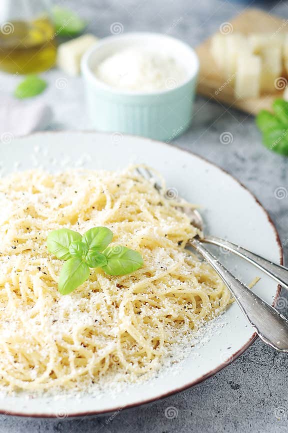 Spaghetti with Italian Cheese Pecorino Romano Stock Photo - Image of ...