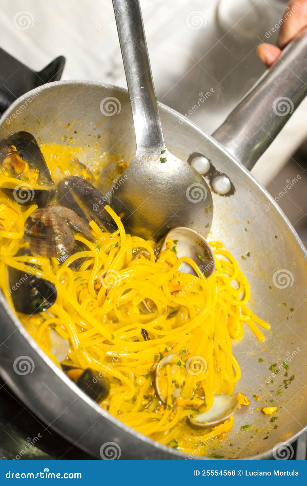 Spaghetti with Mussels, Clams and Saffron. Stock Photo Image of clams
