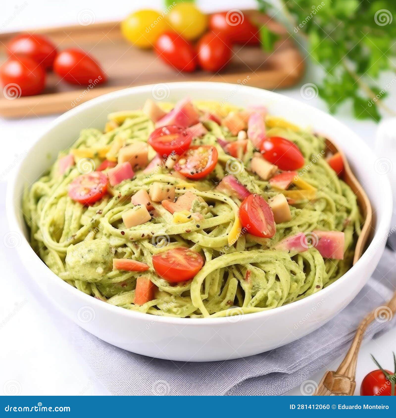 Spaghetti with Pesto Sauce and Cherry Tomatoes on a White Background