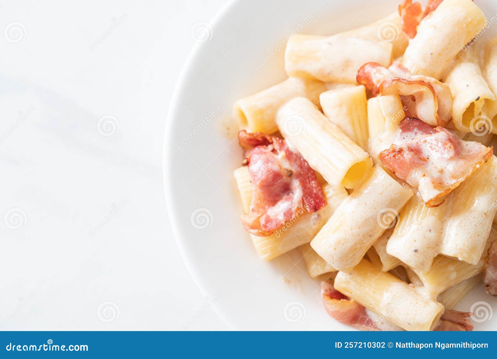 Spaghetti Rigatoni Pasta with White Sauce and Bacon Stock Photo - Image