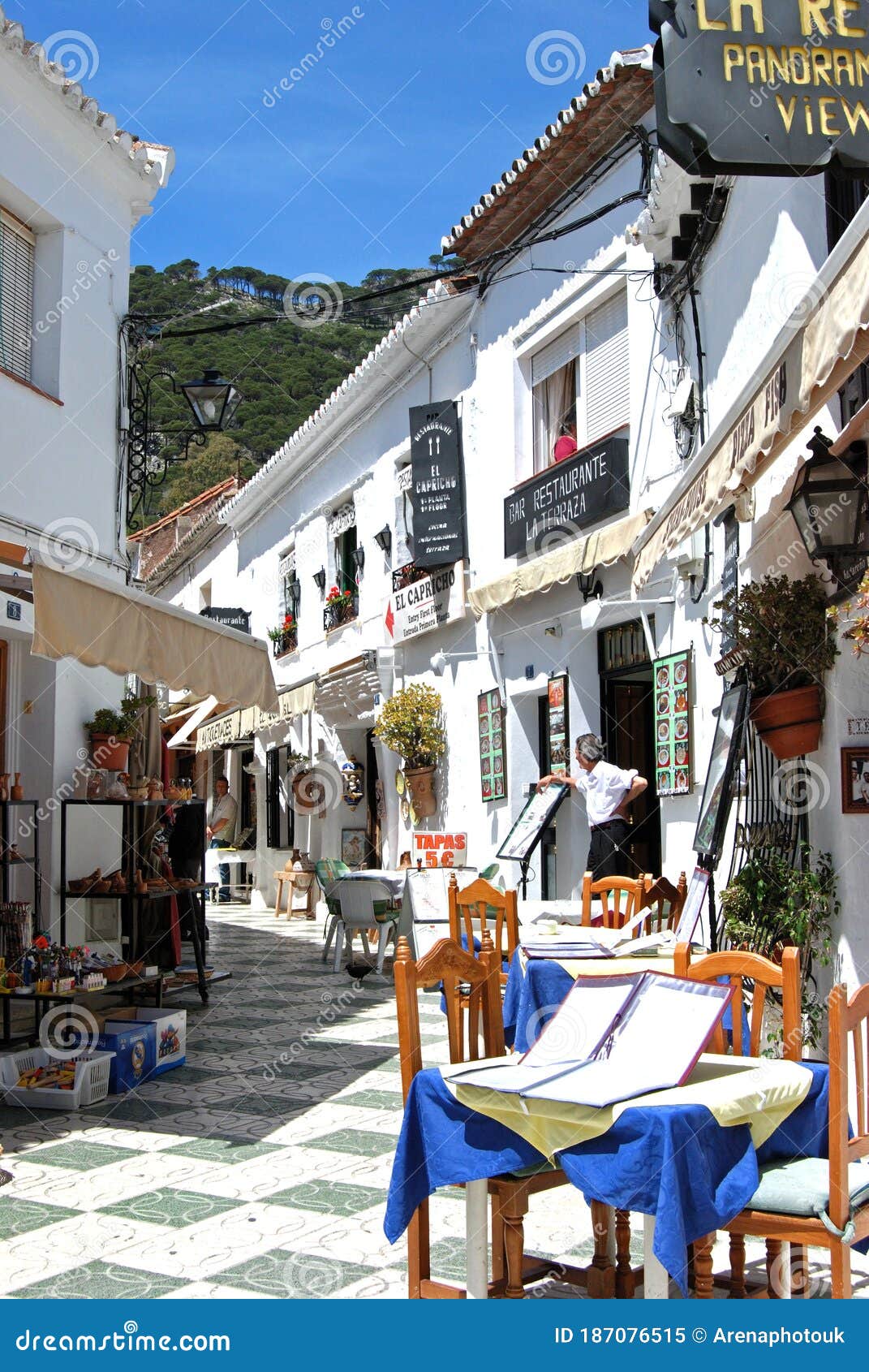 White Village Street with Shops and Cafes, Mijas, Spain. Editorial