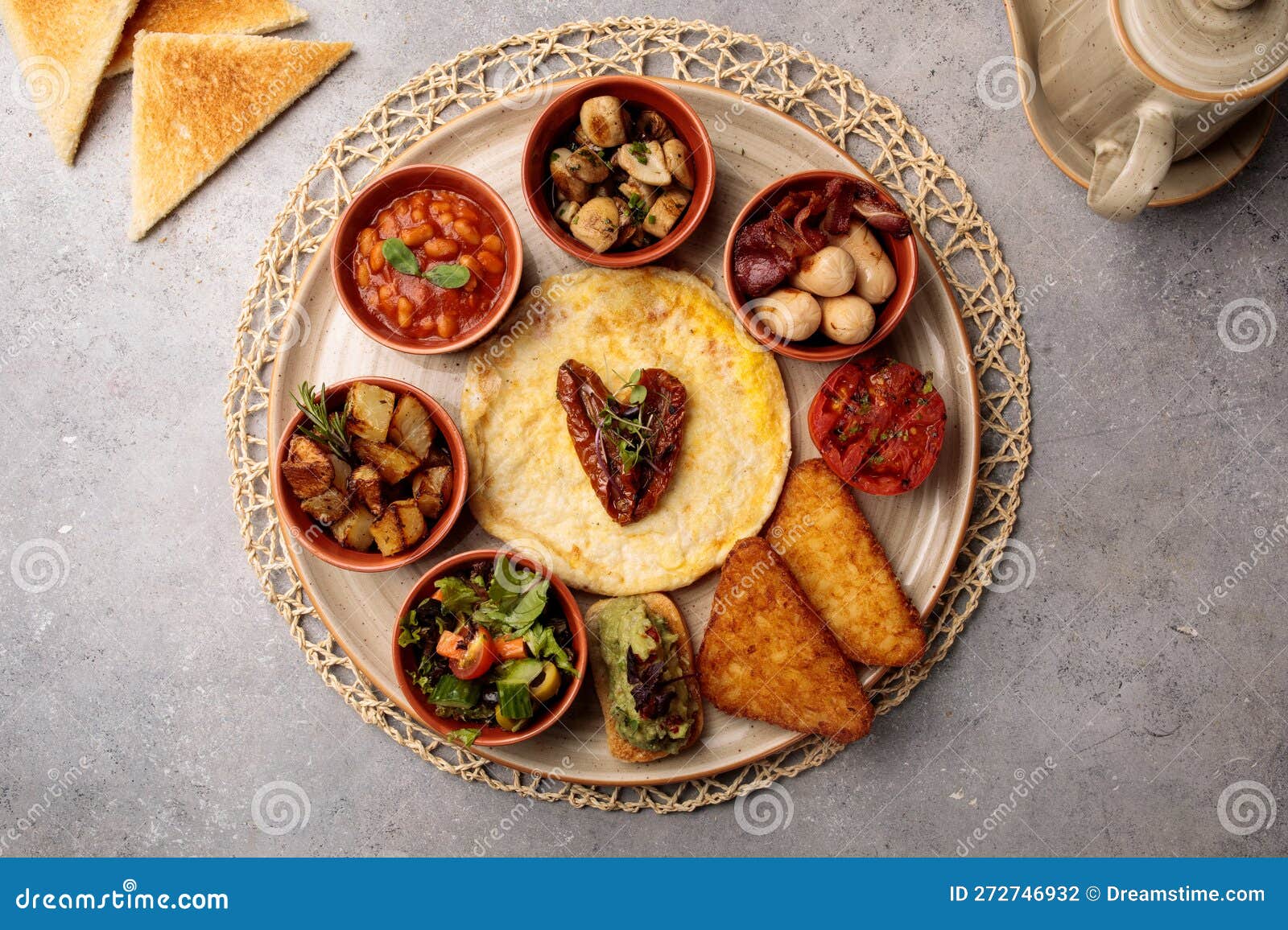 Spanish Breakfast with Bread, Beans, Salad and Fish Served in Dish