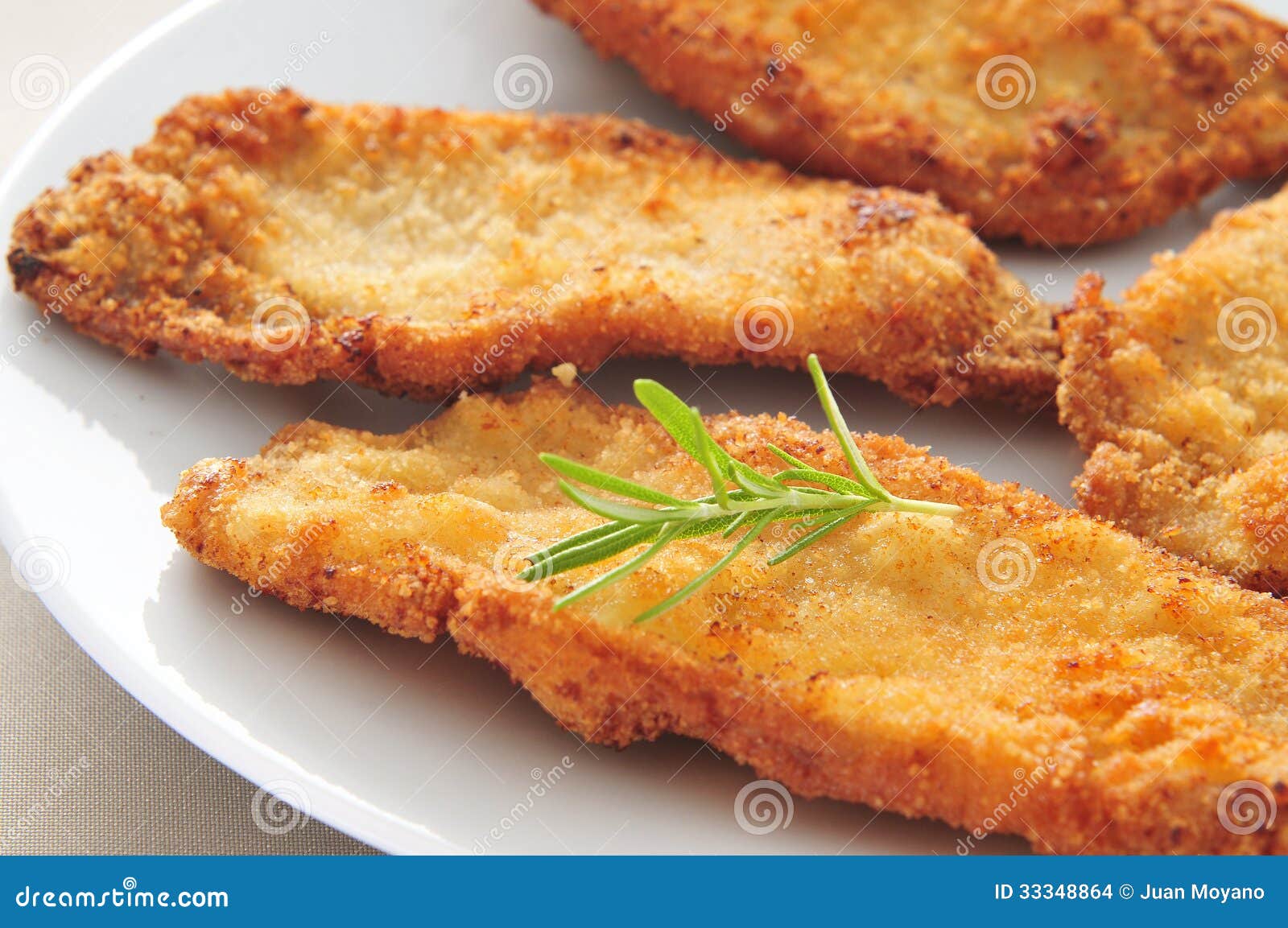 spanish escalopa de pollo a la milanesa, breaded chicken fillets