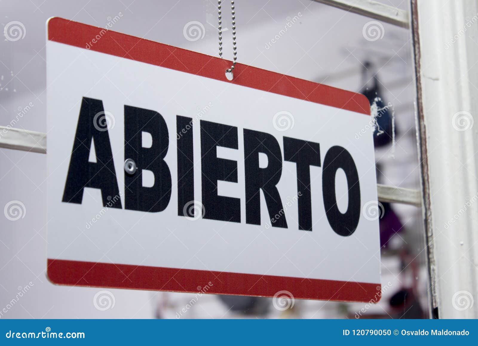 close-up of an open sign in spanish. `abierto`