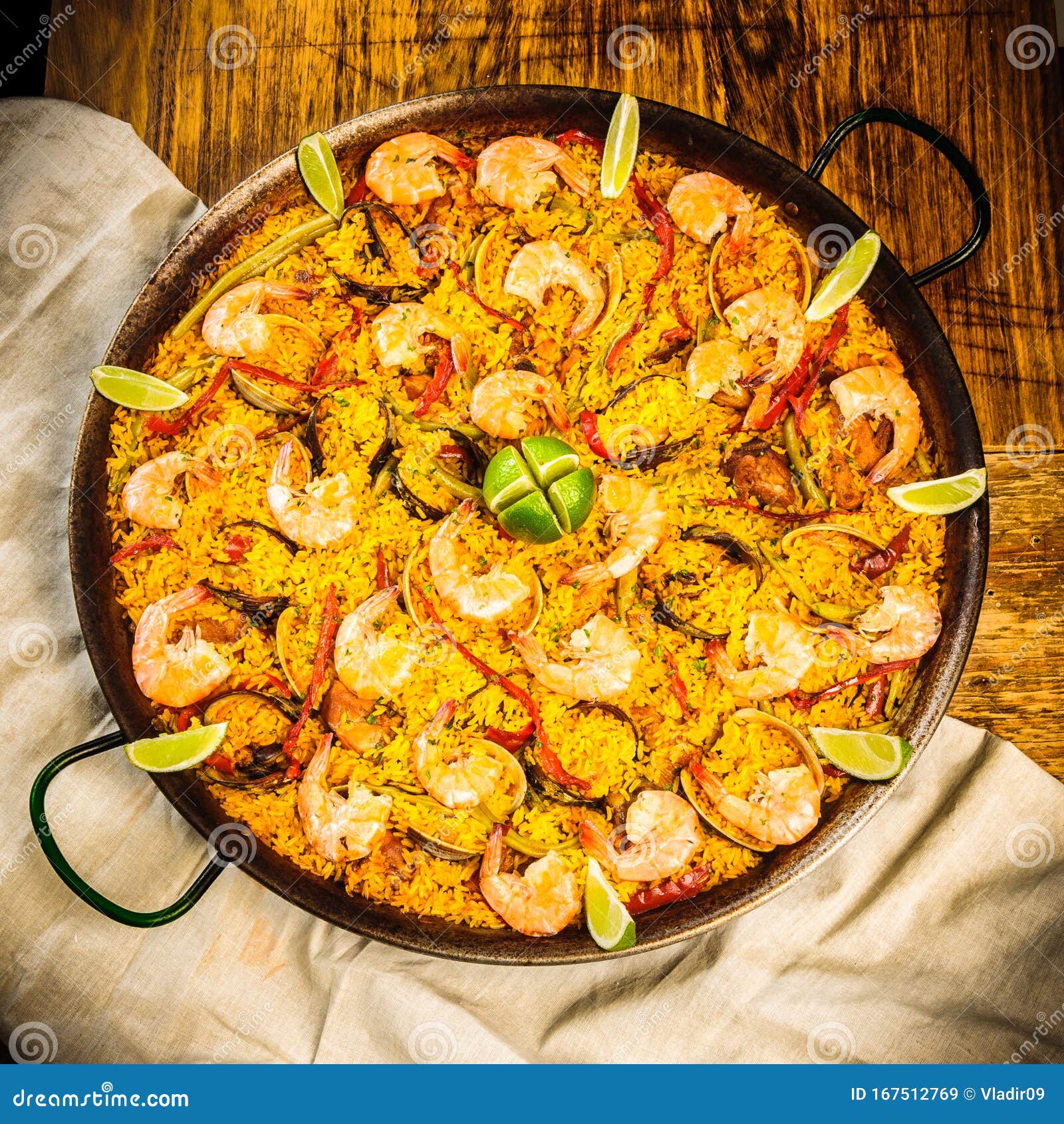 spanish paella with seafood, rice and bell peppers