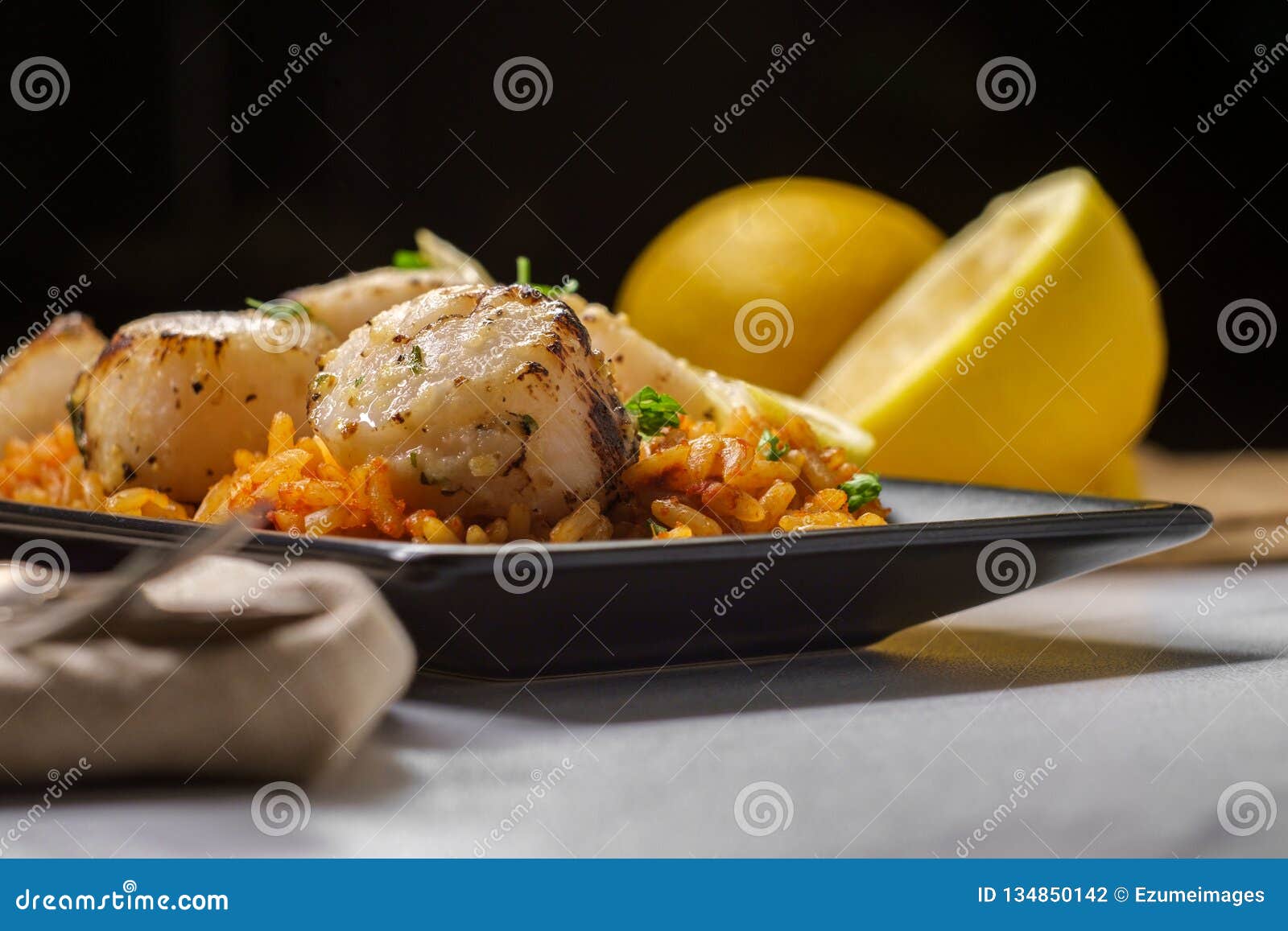 Spanish Rice Lemon Scallops Stock Photo Image of cooked, sauce 134850142