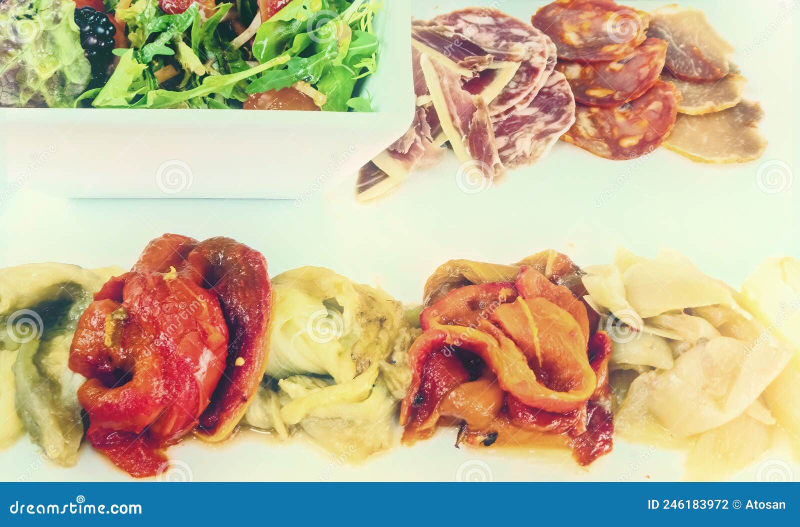 Spanish Tapas with Mixed Meats Salad and Grilled Vegetables Stock Photo