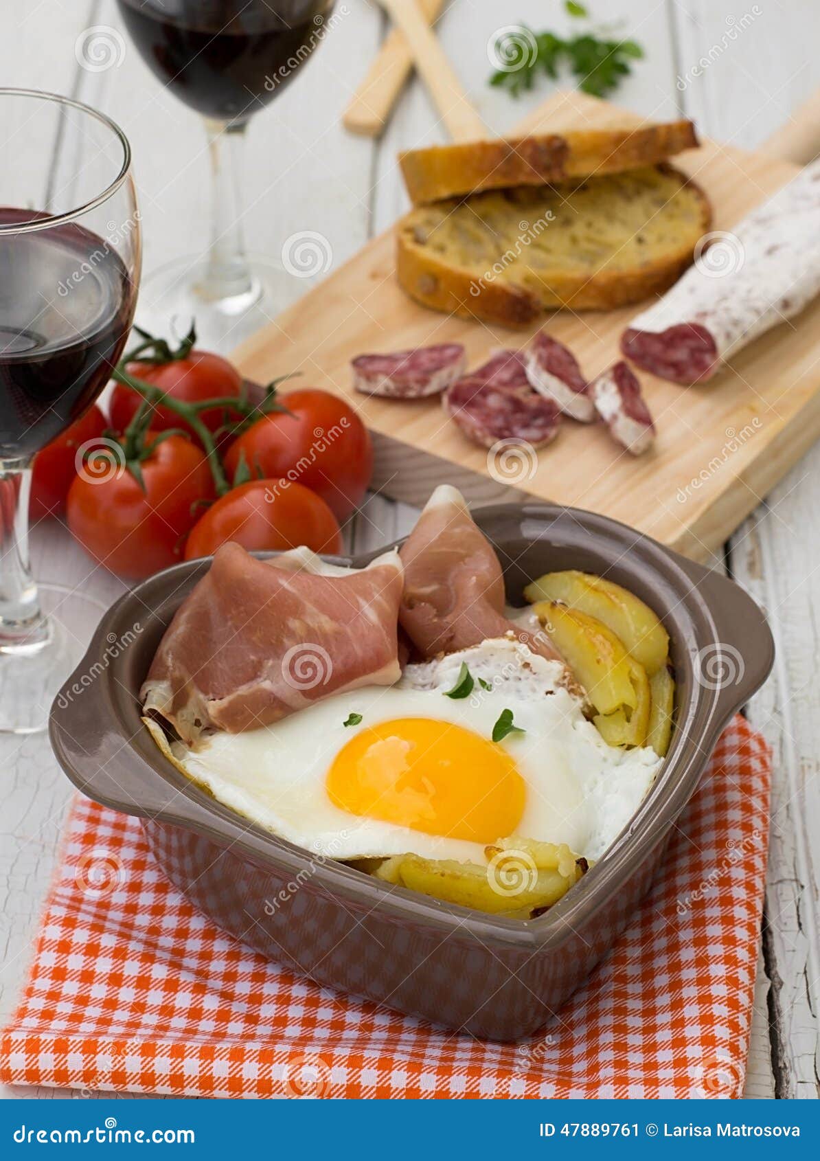 Spanish Traditional Dish Fried Eggs with Serrano Ham and Potatoes Stock