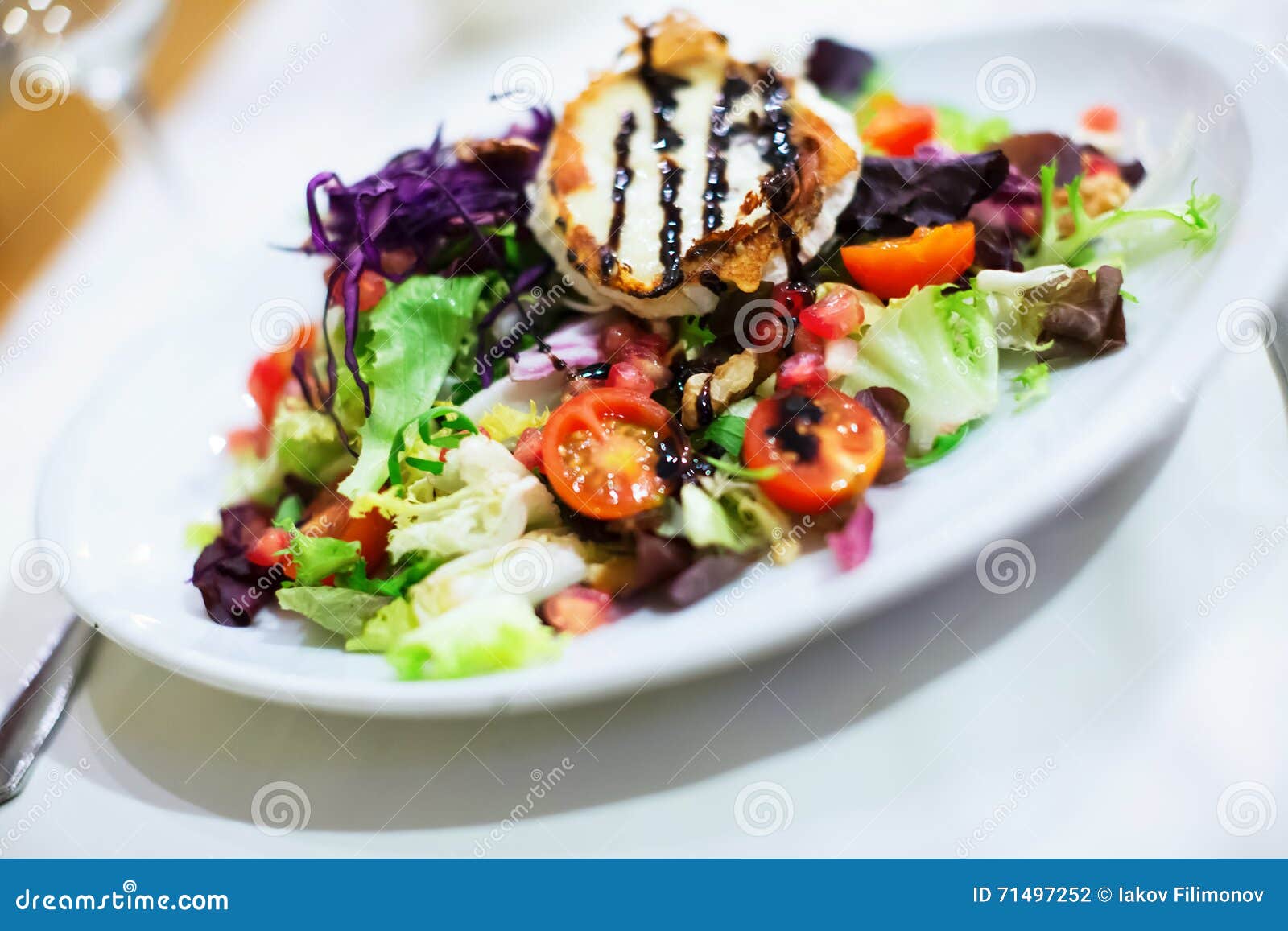 Spanish Vegetable Salad with Dressing on White Plate Stock Photo